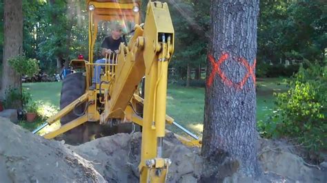 diggingup stump with a skid steer attachments backhoe|Digging Stumps w/709 Backhoe Attachment .